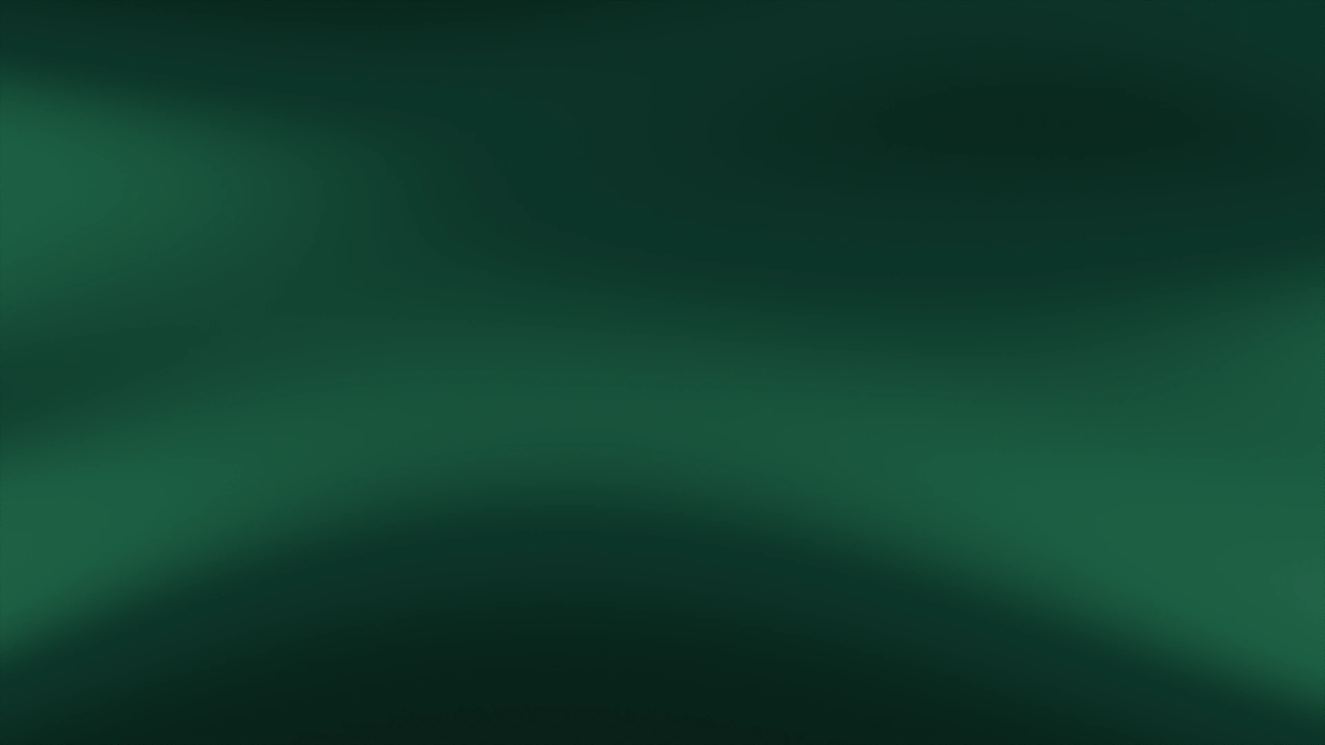 Emerald and forest-green light against a dark charcoal background